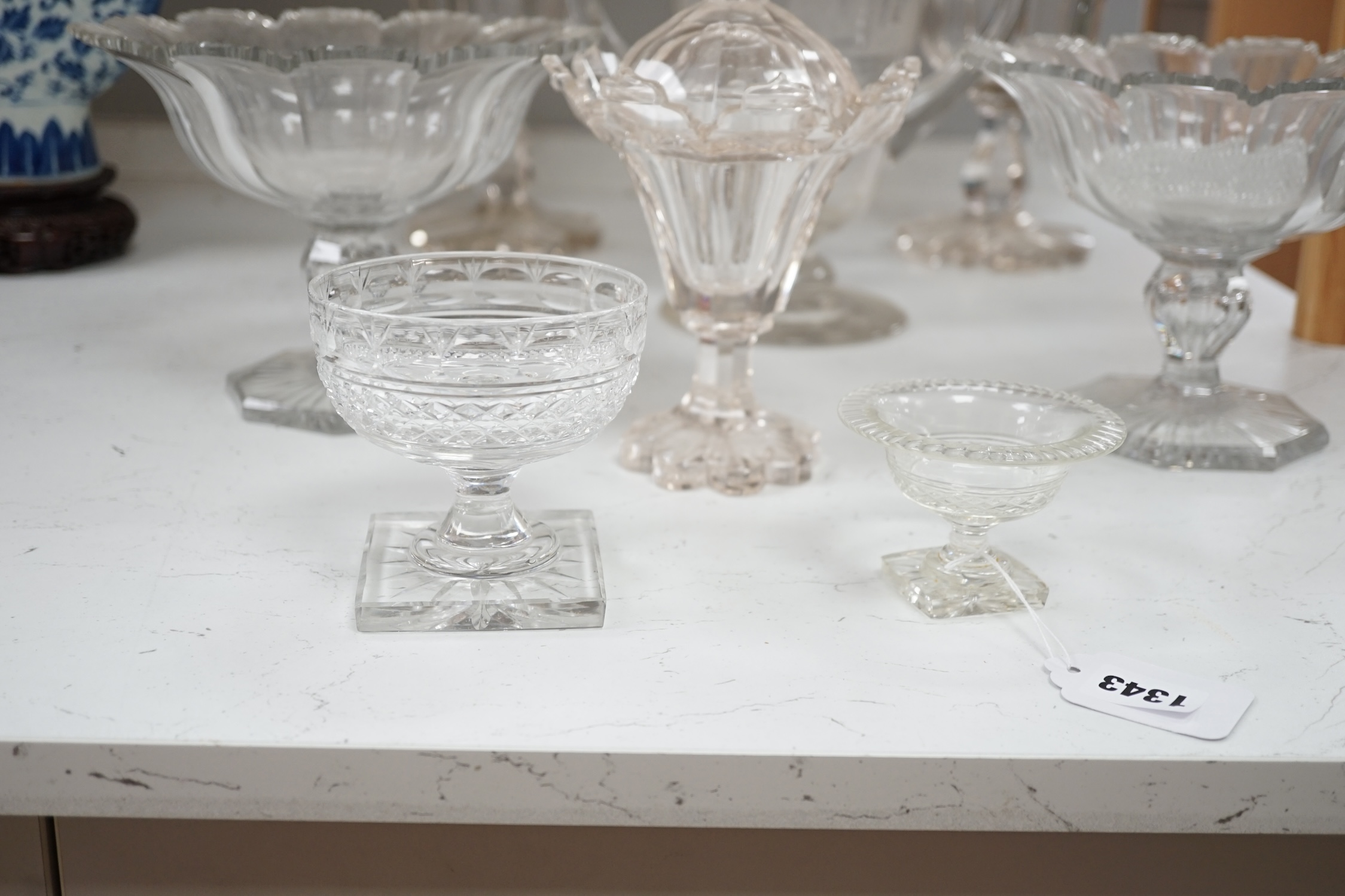 19th century and later glassware to include a pair of glass confitures (one cover), a twin handled etched cup, etc. largest 38cm high. Condition - fair